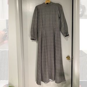 Black and white belted long-sleeved houndstooth dress
